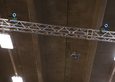 A drone in flight nears the 23 foot ceiling.