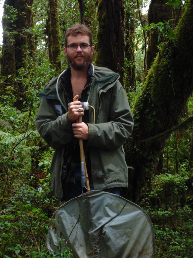 Andrew Jansen poses with a bug net in Guatemala