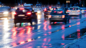 Stock image of traffic on a rainy highway at dusk