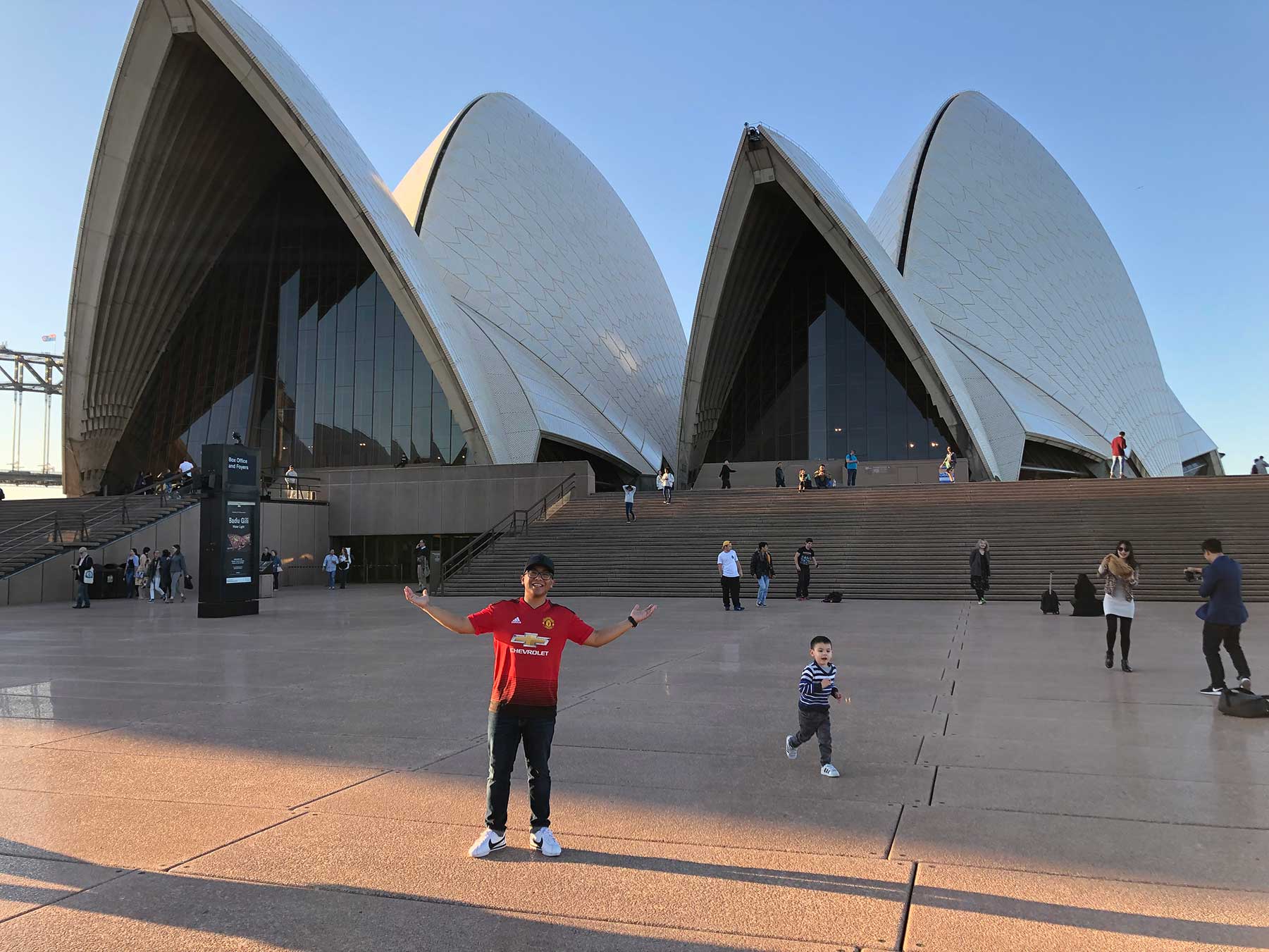 Study Abroad student Leonardo Velasco stands in front of the Sydney Opera House in Sydney Australia