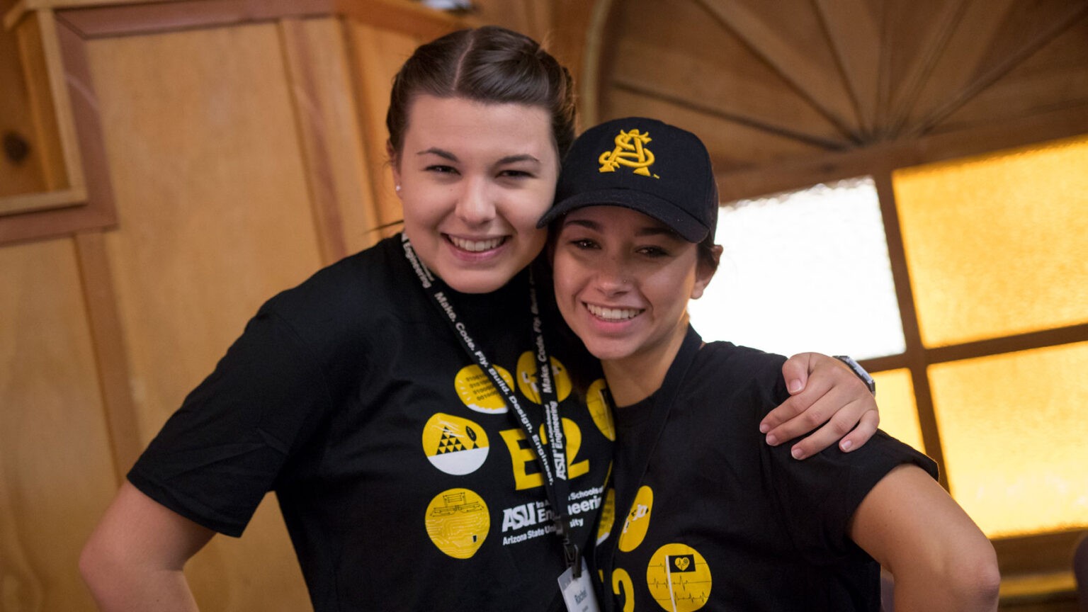 Two ASU E2 camp counselors pose for a picture, arms around each other and smiling: Rachel Scheller and Elizabeth Jones