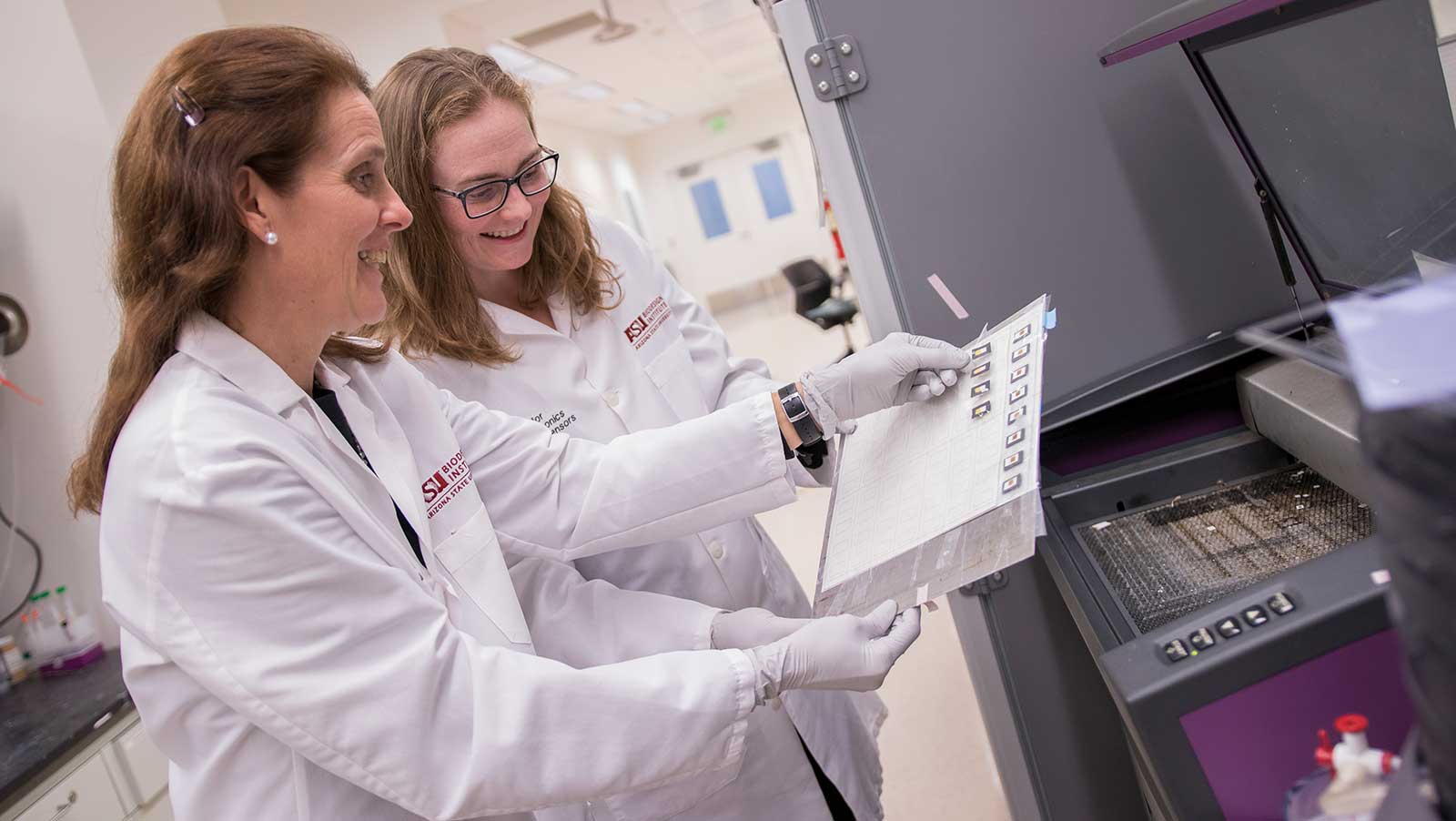 Erika Forzani and Mary Laura Lind work in the lab
