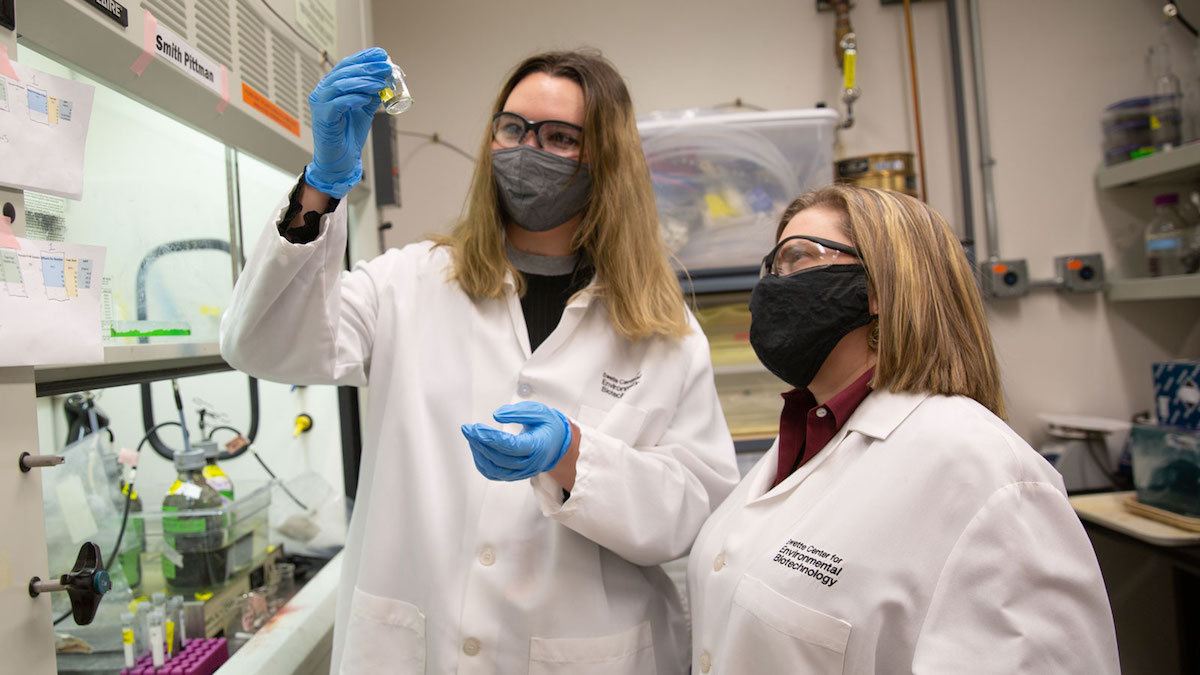 Smith Pittman (left) works with Assistant Research Scientist Michelle Young in a lab