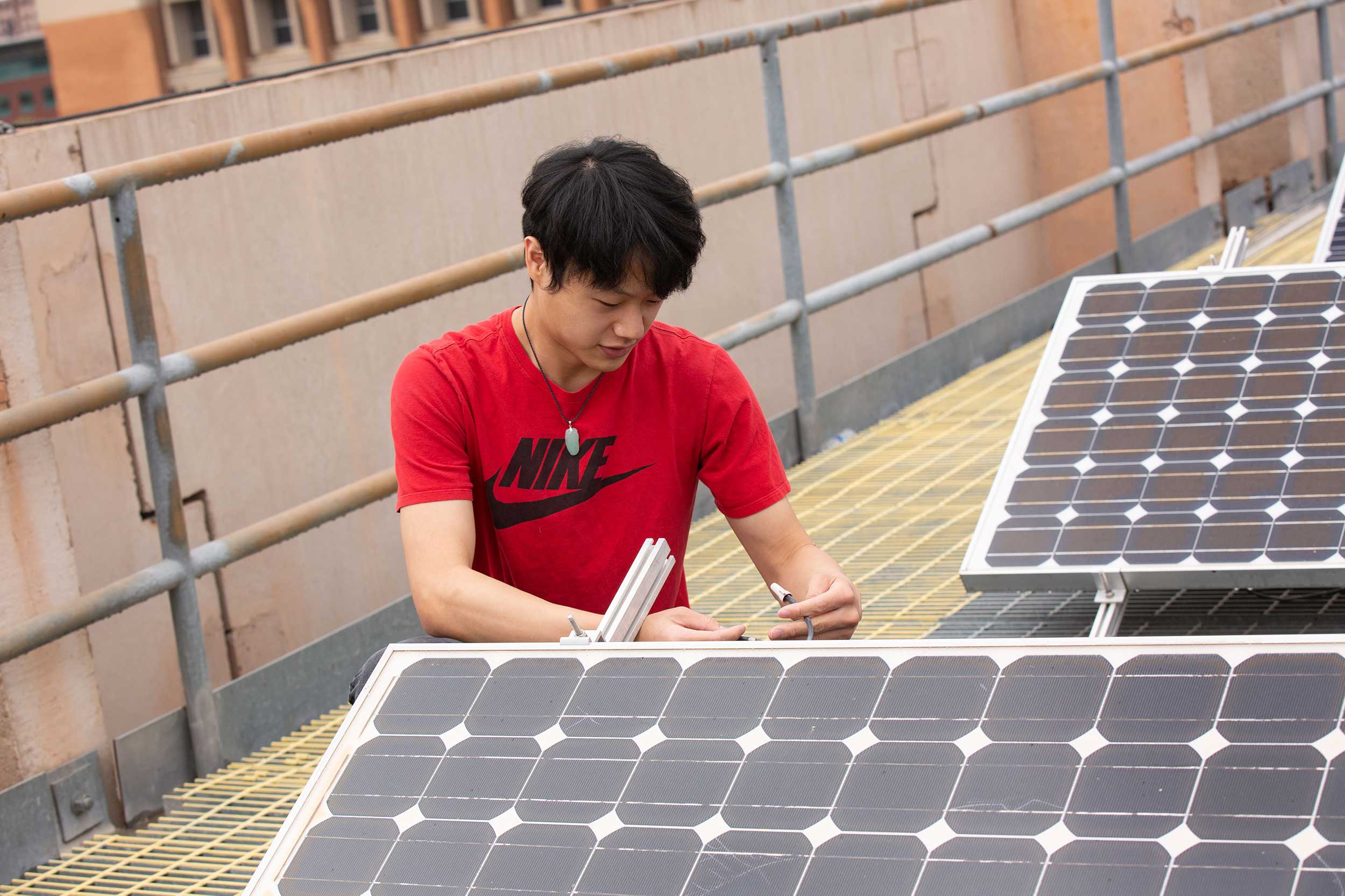 Fulton Schools student Kelvin Tan works on solar panels for his undergraduate research (FURI) project