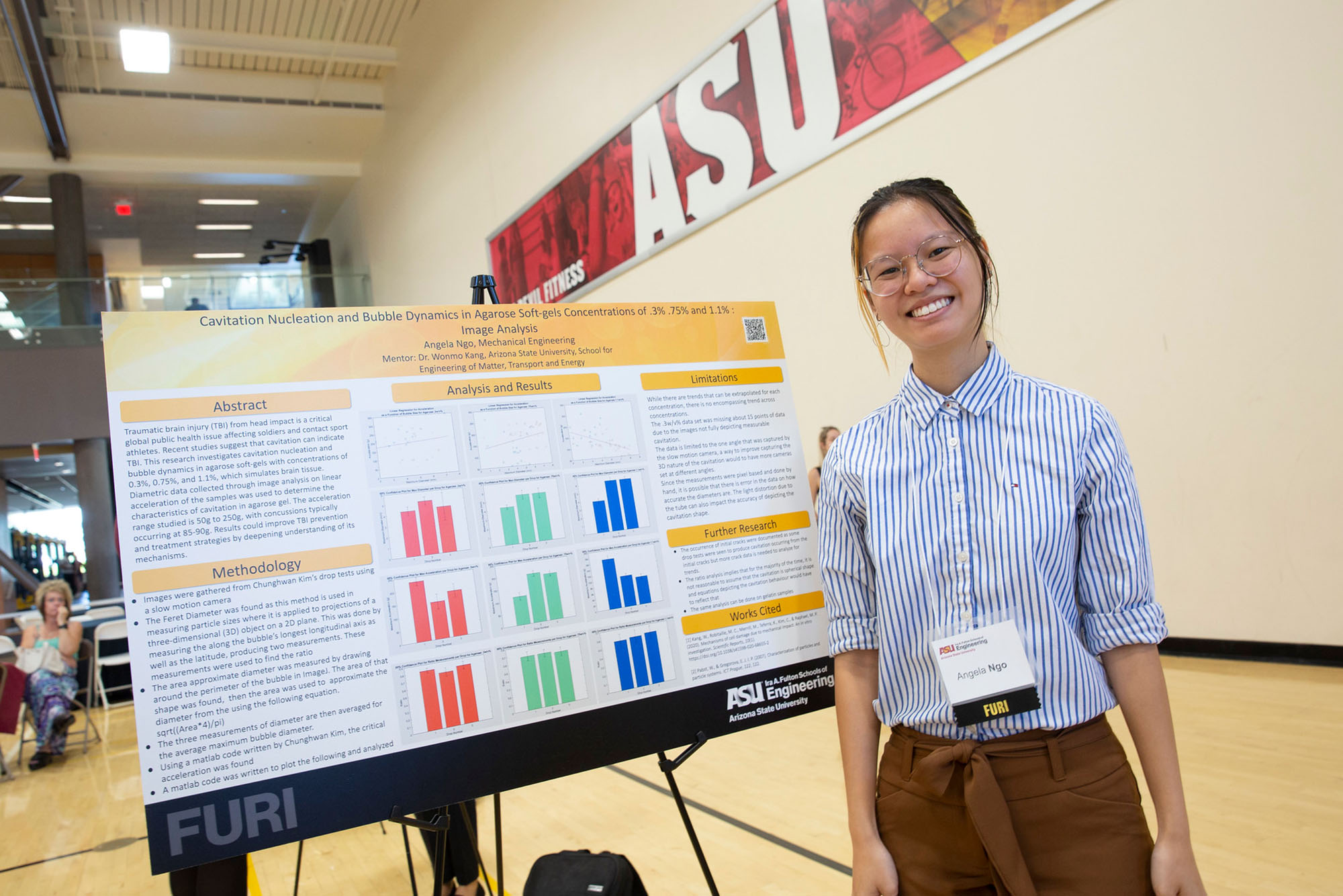 An ASU Engineering student stands next to her research poster at the Spring 2023 FURI Symposium