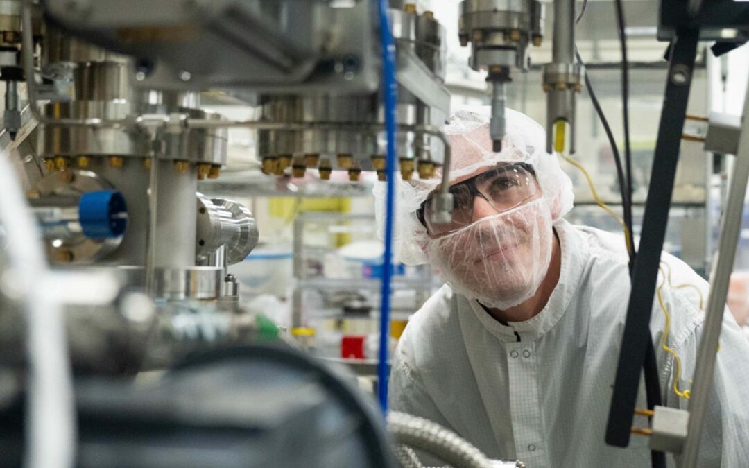 Researcher Tray Moraca inspects a piece of equipment at the MacroTechnology Works research facility.